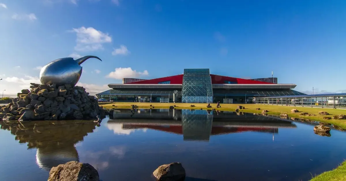 Keflavík Airport terminal reflected in water